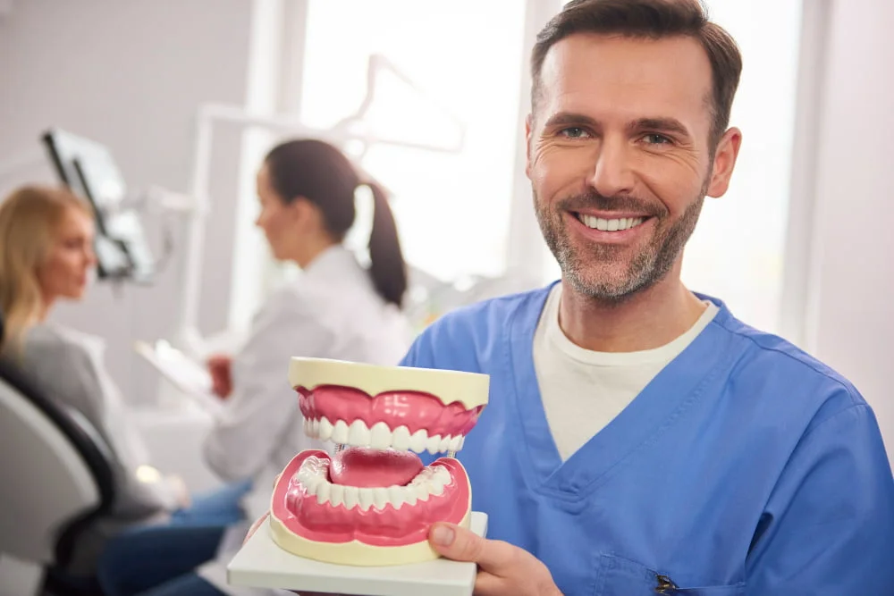 prótese ou implante dentário